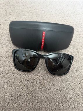 Prada Black Frame Sunglasses with Dark Lenses